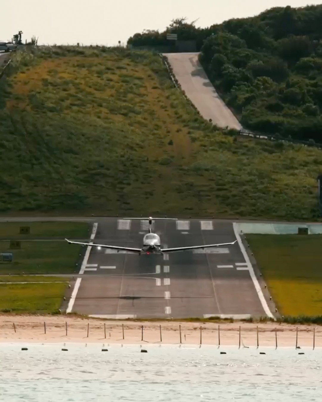 Low pass of brand new Pilatus above St Barth airport